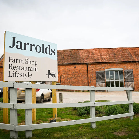 Jarrolds farmshop sign in front of a converted barn