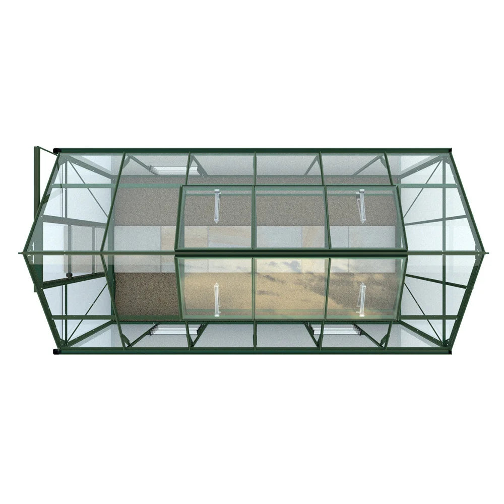 Rhino Greenhouse viewed from above, displaying a rectangular structure with green metal framing and transparent panels, situated on a paved surface, likely for plant cultivation.