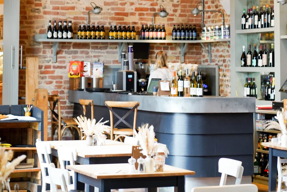 Beautiful counter surrounded by white and beer bottles.
